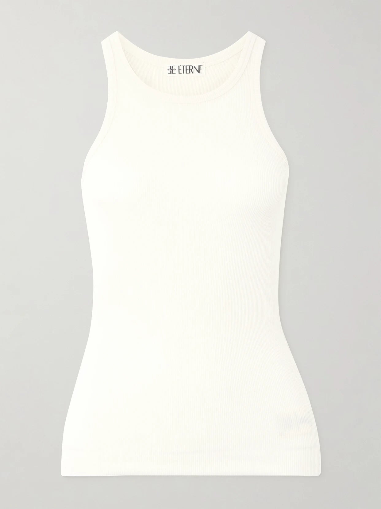 Image of a model wearing Tops. Product name - Ribbed Stretch-jersey Tank in Cream colour by brand - ÉTERNE