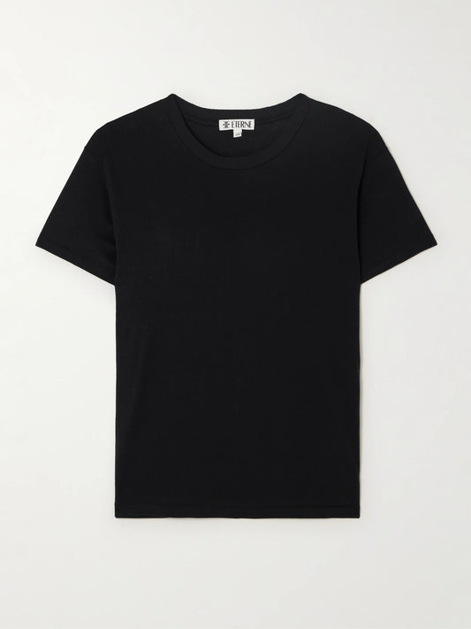 Image of a model wearing Tops. Product name - Boyfriend Cotton And Modal-blend Jersey T-shirt in Black colour by brand - ÉTERNE