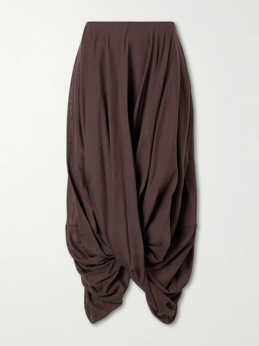 Image of a model wearing Skirts. Product name - Draped Organic Cotton And Lyocell-blend Maxi Skirt in Brown colour by brand - TOTEME