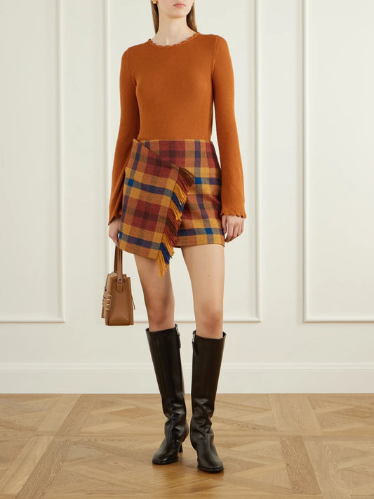 Image of a model wearing Skirts. Product name - Checked Asymmetric Alpaca Mini Skirt in Multi colour by brand - ESCVDO