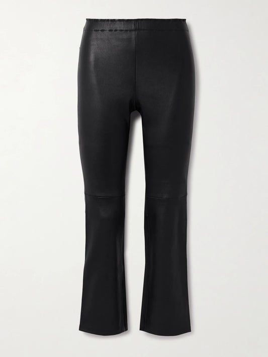 Image of a model wearing Pants. Product name - Jp Twenty Cropped Leather Flared Leggings in Black colour by brand - STOULS