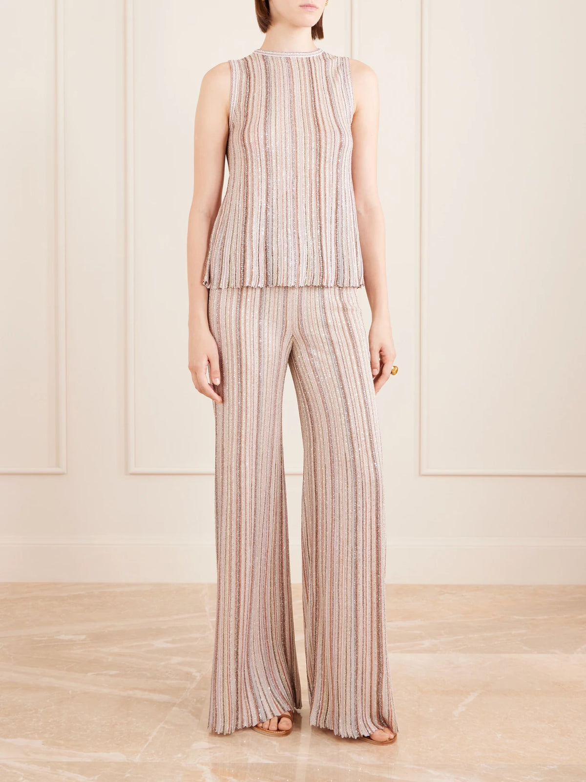 Image of a model wearing Tops. Product name - Metallic Crochet-knit Tank Top in Cream colour by brand - Missoni