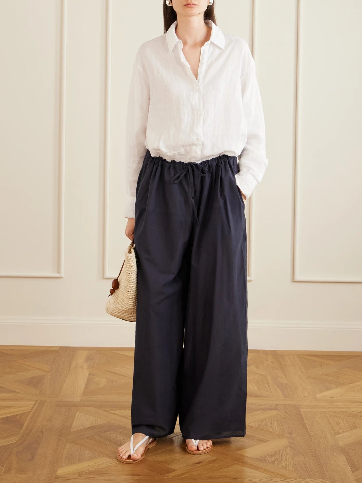 Image of a model wearing Pants. Product name - The Pantaloons Cotton-poplin Wide-leg Pants in Navy colour by brand - Les Vacances D'Irina