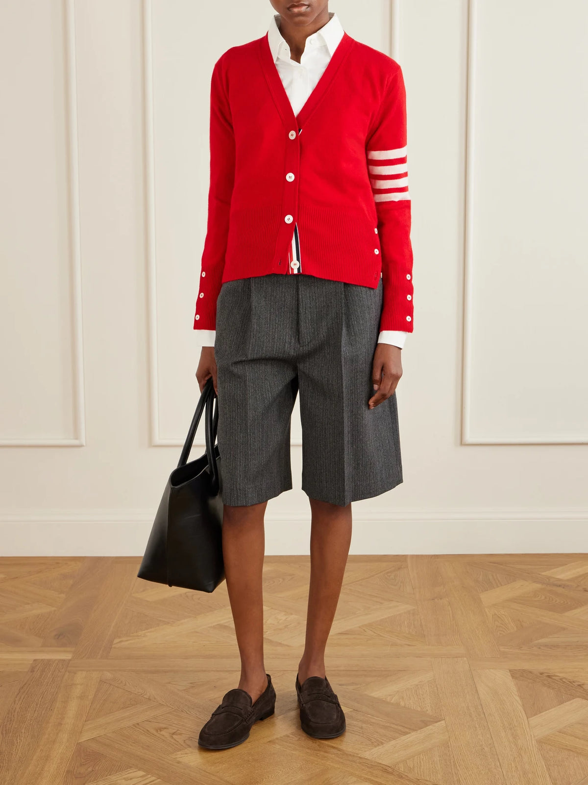 Image of a model wearing Outerwear. Product name - 4-bar Cashmere Cardigan in Red colour by brand - Thom Browne