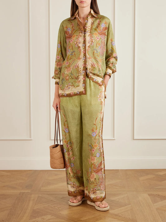 Image of a model wearing Tops. Product name - Indra Floral-print Relaxed Shirt in Green colour by brand - Zimmermann