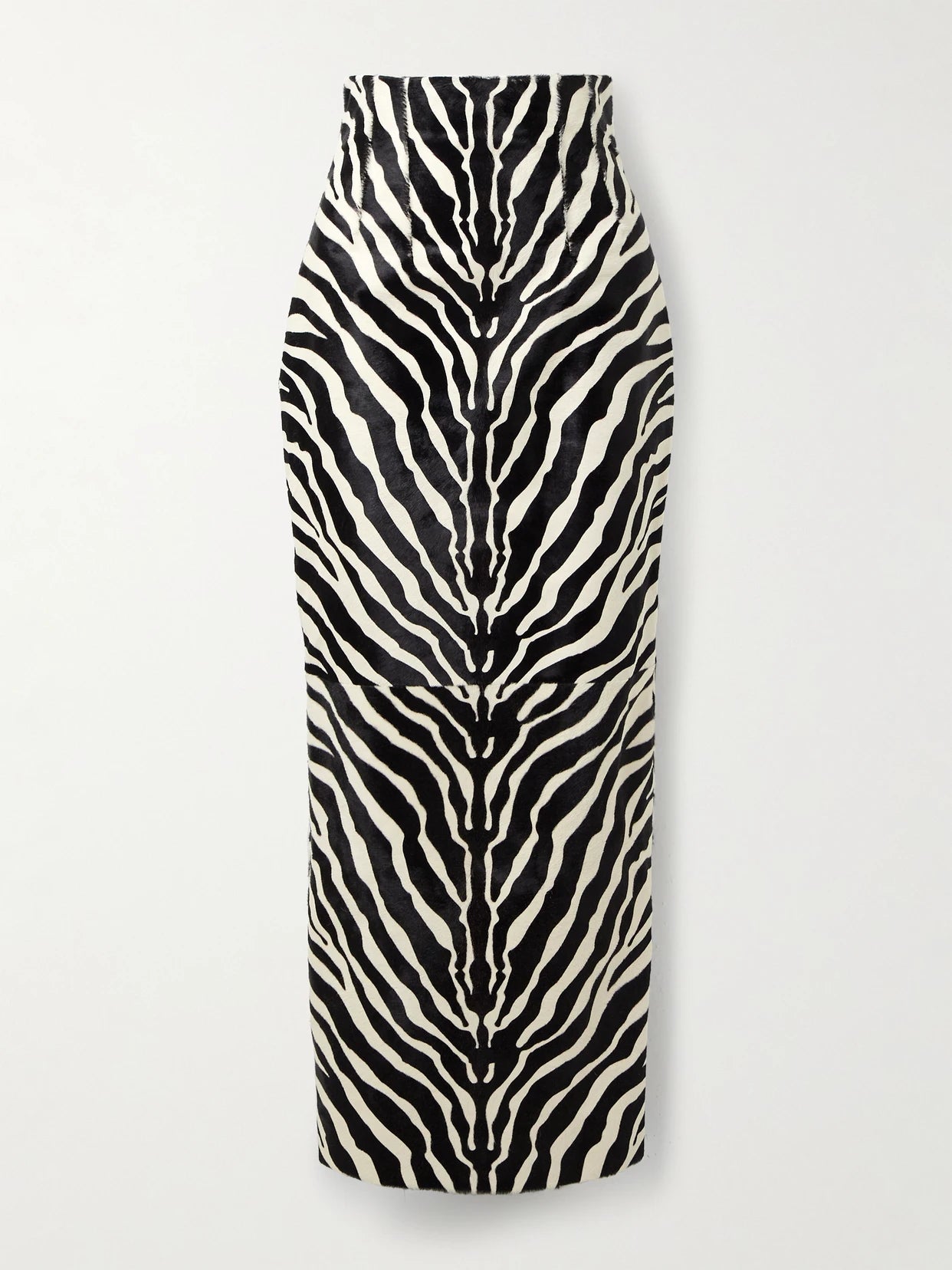 Image of a model wearing Skirts. Product name - Loxley Zebra-print Calf Hair Midi Skirt in Zebra print colour by brand - KHAITE