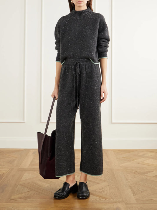 Image of a model wearing Outerwear. Product name - Cropped Donegal Cashmere Turtleneck Sweater in Gray colour by brand - Calle Del Mar
