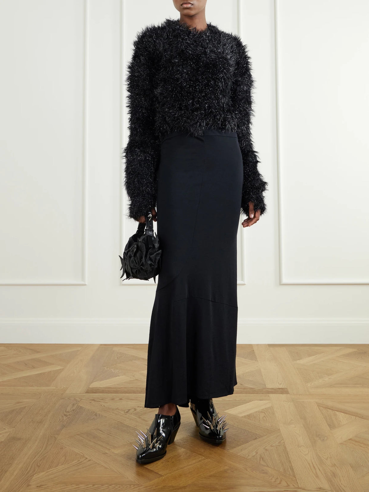 Image of a model wearing Outerwear. Product name - Distressed Plush Sweater in Black colour by brand - Junya Watanabe