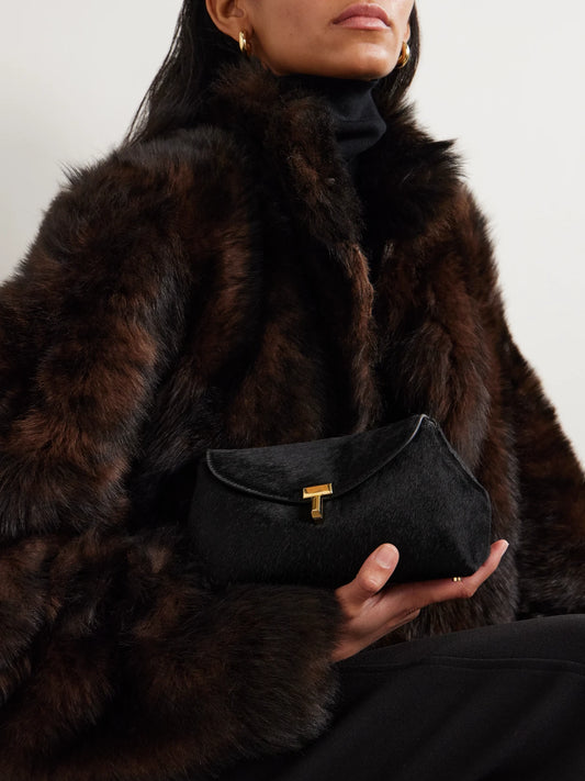 Image of Bags. Product name - T-lock Mini Calf Hair Clutch in Black colour by brand - TOTEME