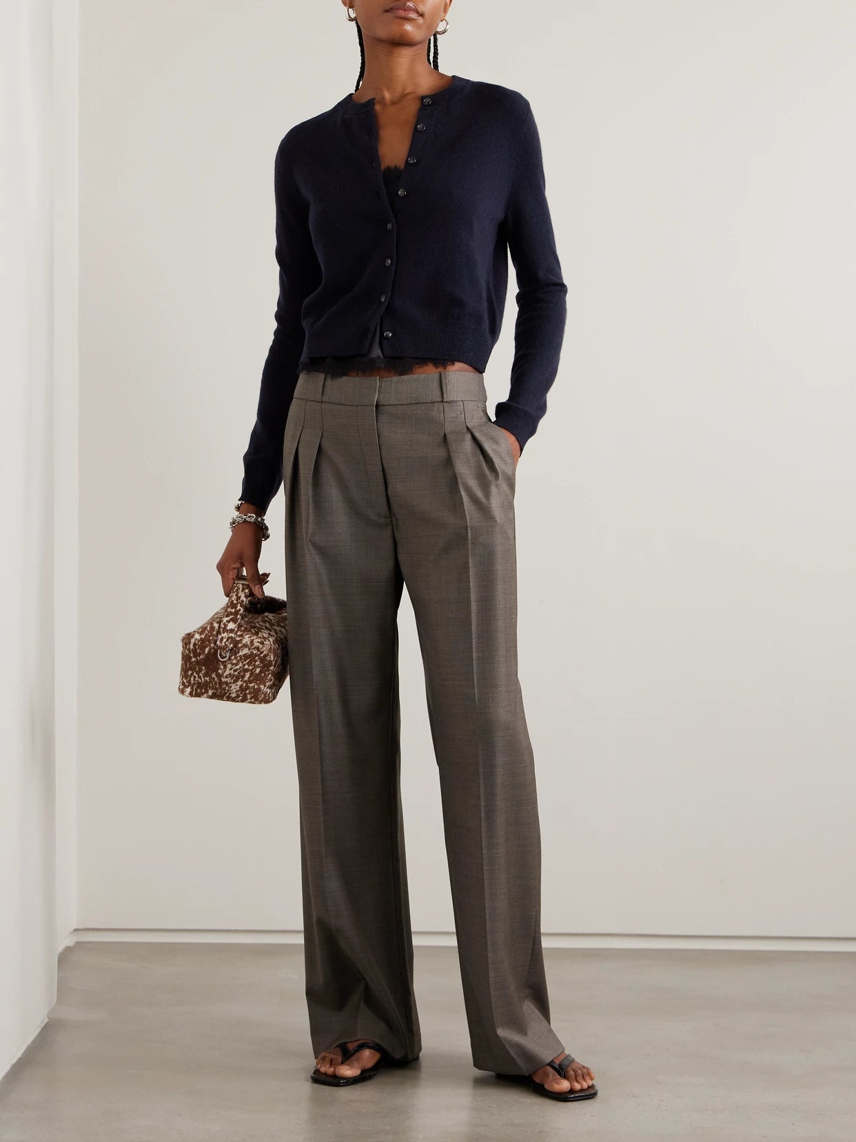 Image of a model wearing Outerwear. Product name - Karia Cashmere Cardigan in Navy colour by brand - LISA YANG