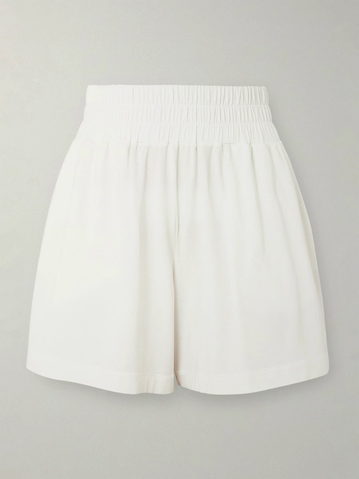 Image of a model wearing Shorts. Product name - Mia Embroidered Modal-blend Jersey Shorts in White colour by brand - Eres