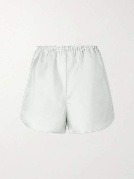 Image of a model wearing Shorts. Product name - Cabo Silk-twill Shorts in Light blue colour by brand - Loulou de Saison