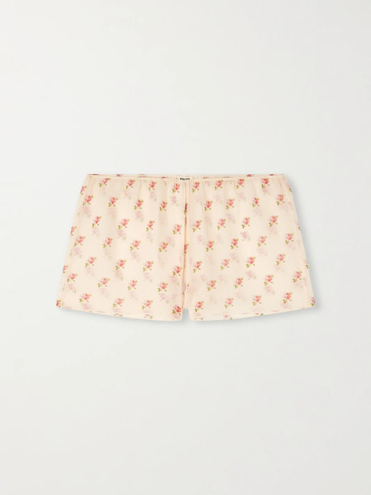 Image of a model wearing Shorts. Product name - Tilly Floral-print Silk-chiffon Shorts in Baby pink colour by brand - KHAITE