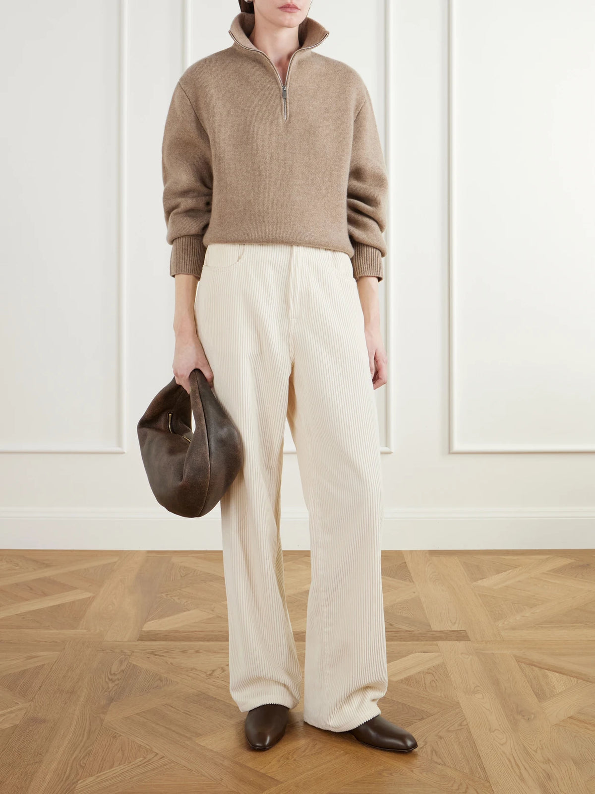 Image of a model wearing Outerwear. Product name - Dana Merino Wool And Cashmere-blend Half-zip Sweater in Camel colour by brand - Almada