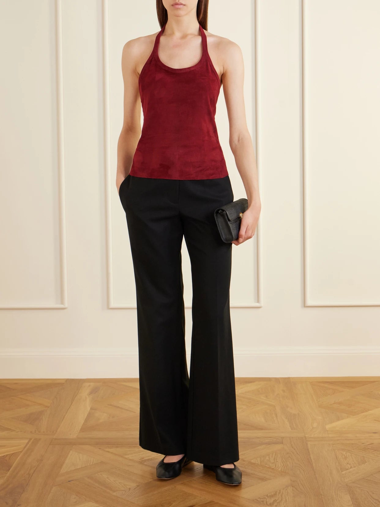 Image of a model wearing Tops. Product name - Cherry Open-back Suede Halterneck Tank in Red colour by brand - STOULS