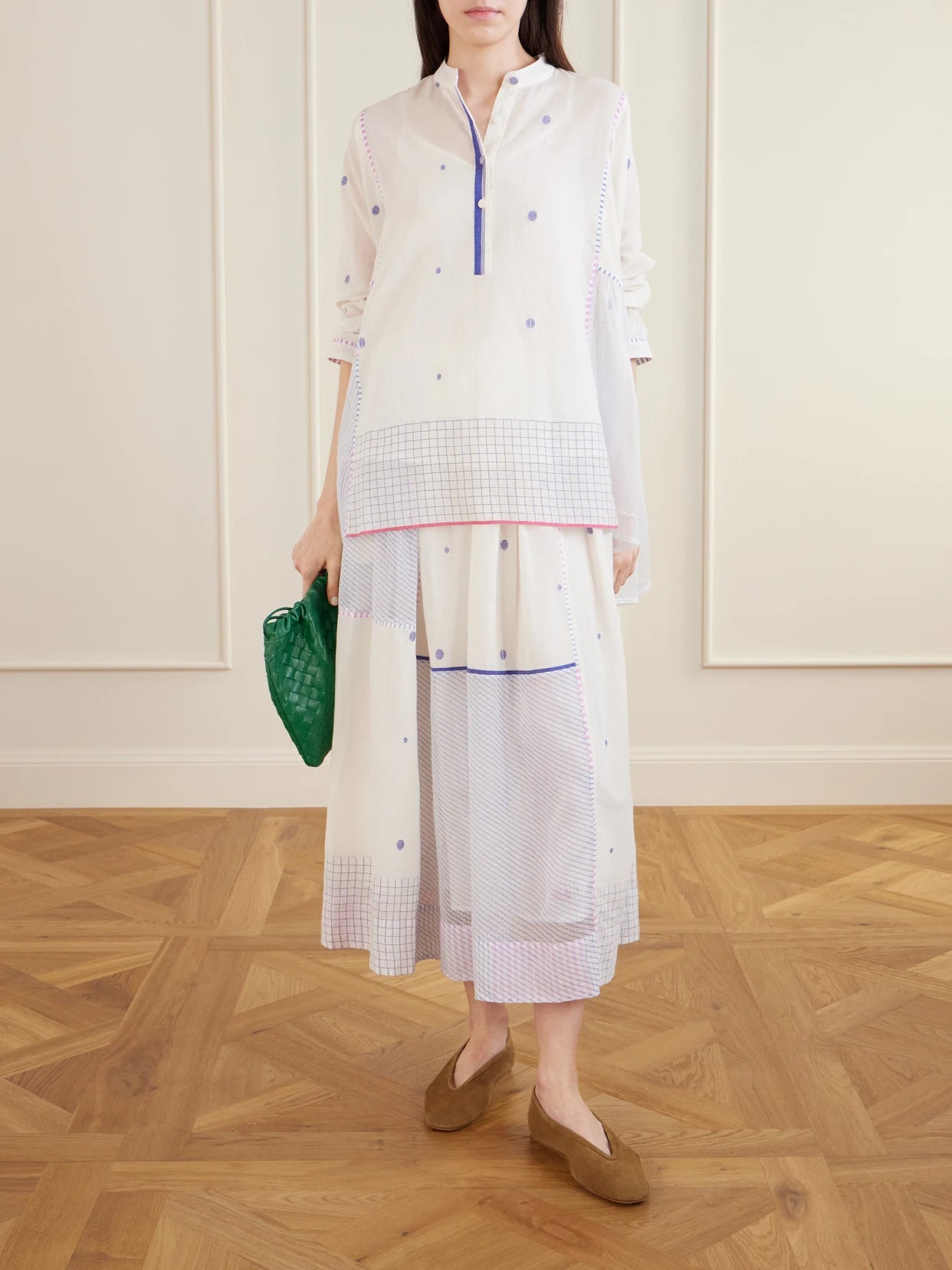 Image of a model wearing Skirts. Product name - Gathered Striped Cotton-jamdani Midi Skirt in Off-white colour by brand - Eka