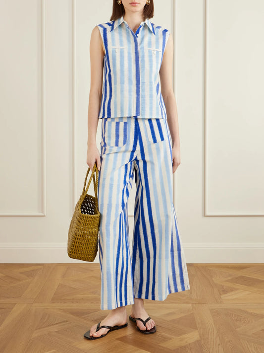 Image of a model wearing Pants. Product name - Striped Wide-leg Cotton Pants in Blue colour by brand - Emporio Sirenuse