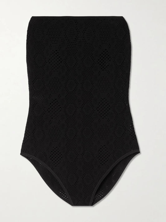 Image of a model wearing Tops. Product name - Strapless Pointelle-knit Bodysuit in Black colour by brand - Alaïa