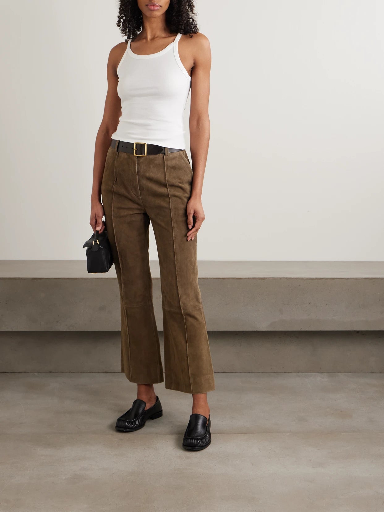 Image of a model wearing Tops. Product name - Loretta Cotton-jersey Tank in White colour by brand - Nili Lotan