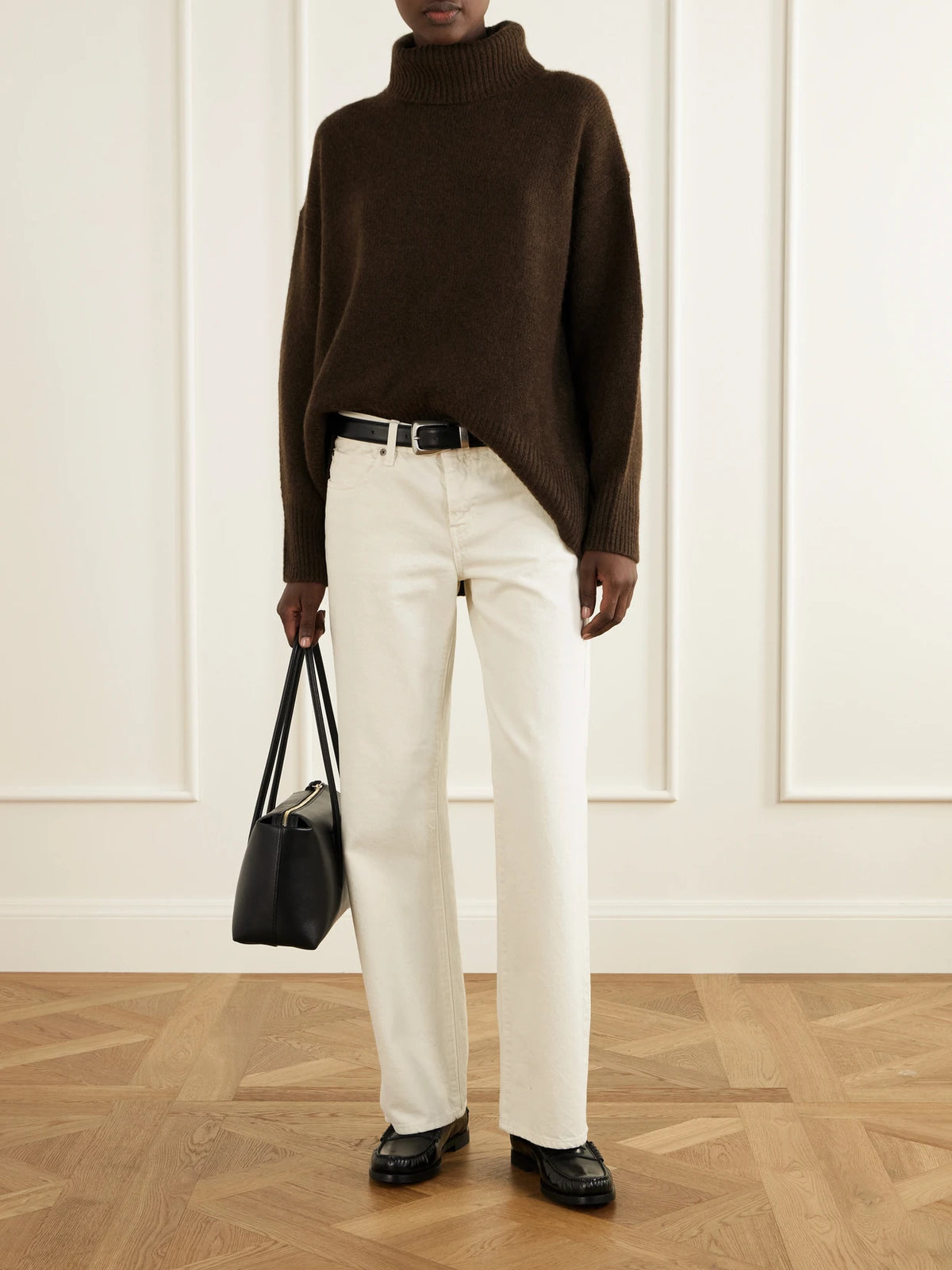 Image of a model wearing Outerwear. Product name - World's End Cashmere Turtleneck Sweater in Brown colour by brand - Arch4