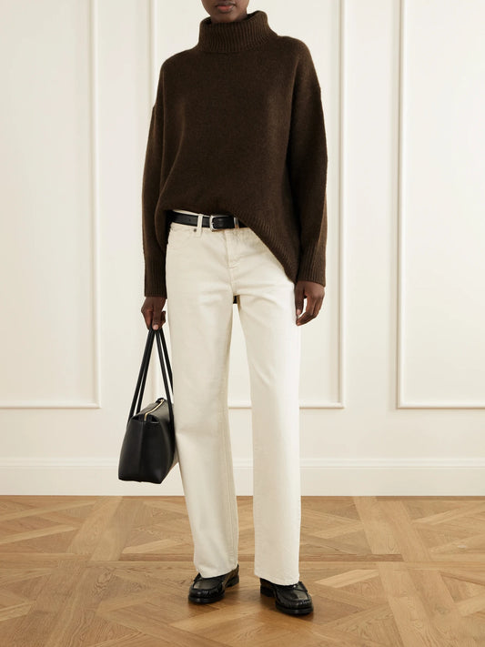 Image of a model wearing Outerwear. Product name - World's End Cashmere Turtleneck Sweater in Brown colour by brand - Arch4