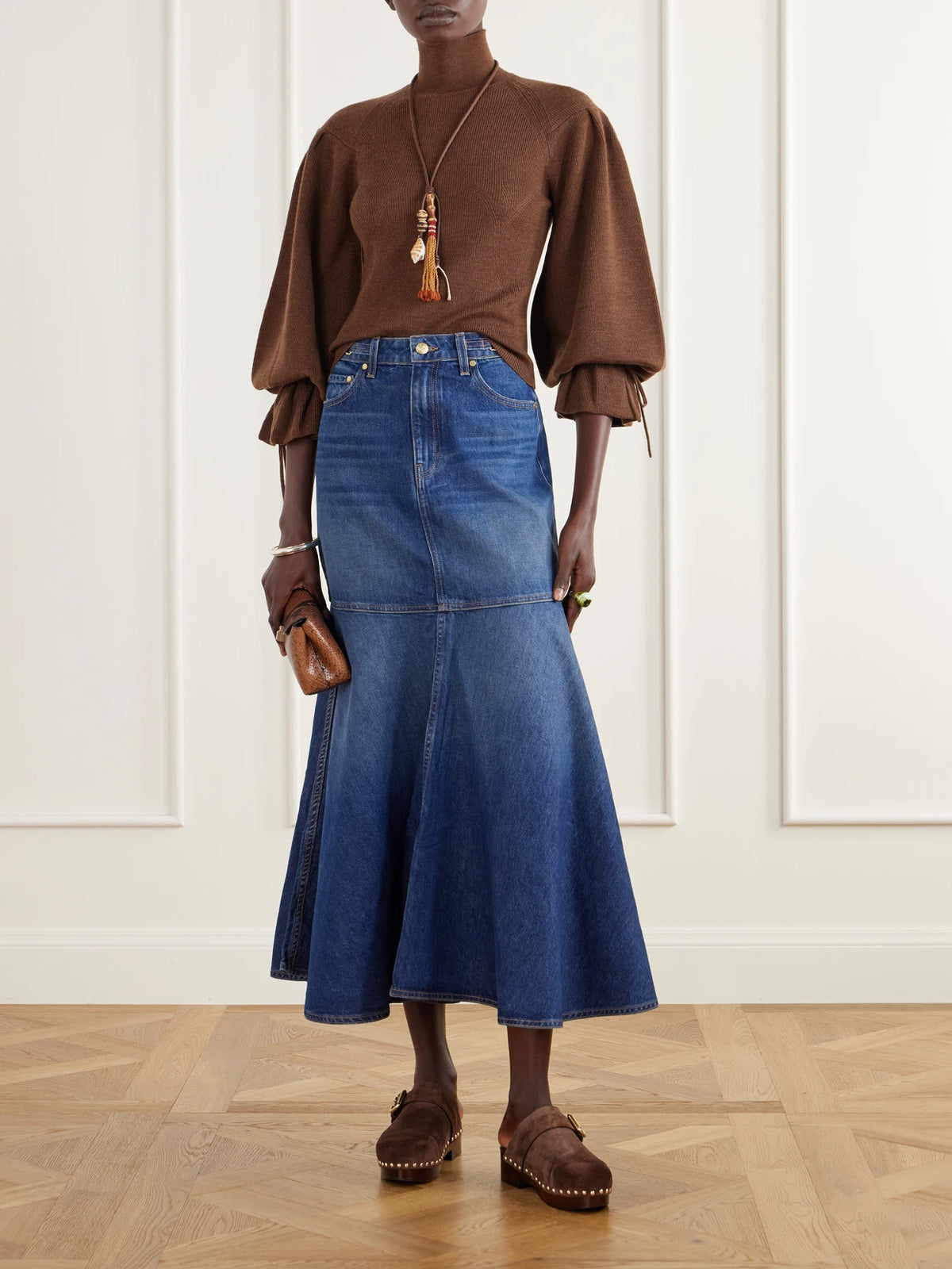 Image of a model wearing Skirts. Product name - The Madelyn Embellished Paneled Denim Maxi Skirt in Mid denim colour by brand - Ulla Johnson