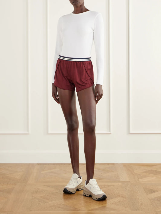 Image of a model wearing Shorts. Product name - Seamless Stripe 3" Stretch Open-knit Running Shorts in Burgundy colour by brand - lululemon