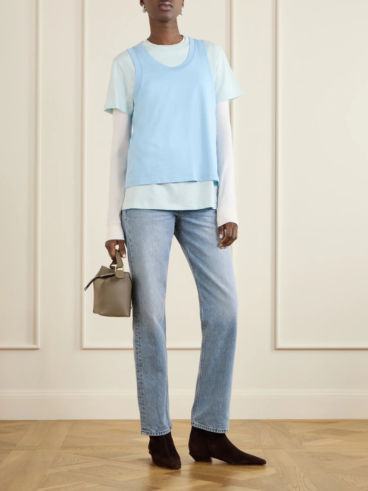 Image of a model wearing Tops. Product name - Layered Cotton-jersey T-shirt in Blue colour by brand - WARDROBE. NYC