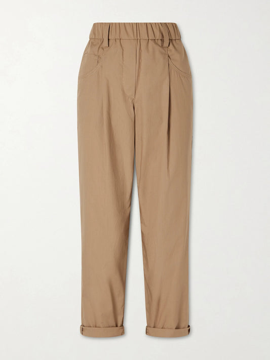 Image of a model wearing Pants. Product name - Cotton-voile Tapered Pants in Beige colour by brand - Brunello Cucinelli