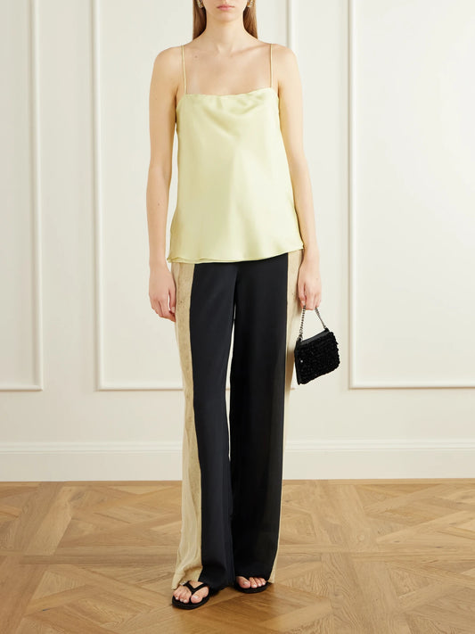 Image of a model wearing Pants. Product name - Sona Silk Crepe De Chine Wide-leg Pants in Cream colour by brand - SIR.
