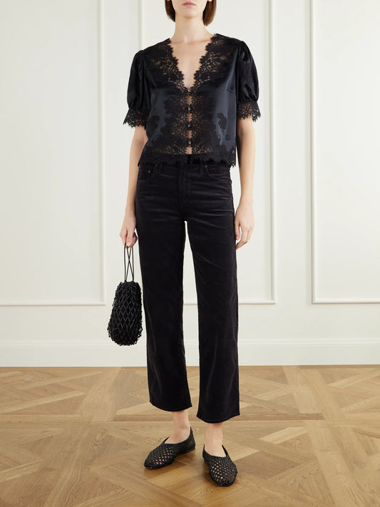 Image of a model wearing Tops. Product name - Idella Lace-trimmed Silk-satin Blouse in Black colour by brand - DÔEN
