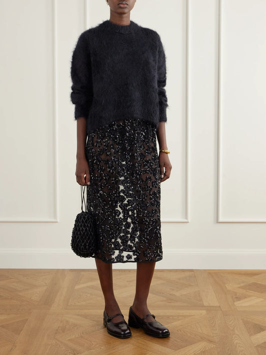 Image of a model wearing Outerwear. Product name - Firall Brushed Mohair And Silk-blend Sweater in Black colour by brand - Cecilie Bahnsen