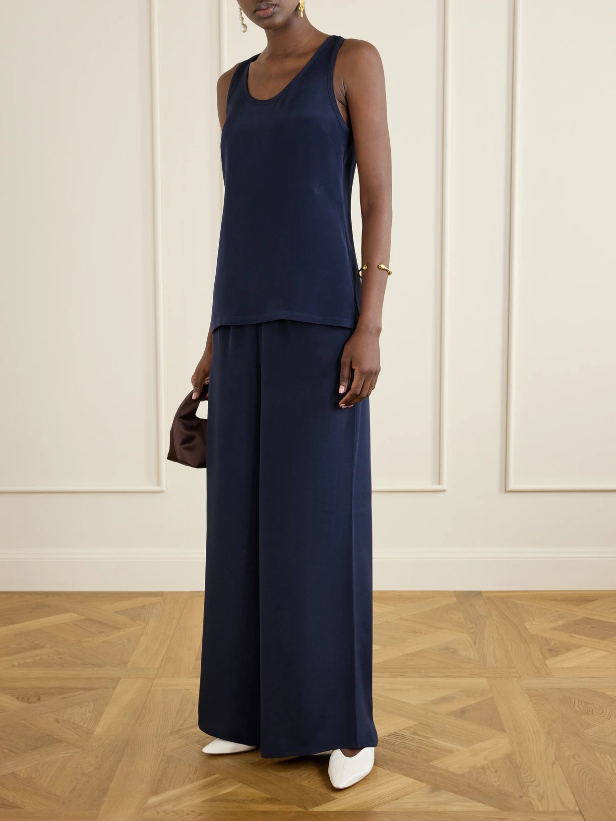 Image of a model wearing Pants. Product name - Logo-embroidered Silk Wide-leg Pants in Navy colour by brand - Max Mara