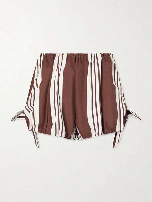 Image of a model wearing Shorts. Product name - Rosie Knotted Striped Cotton-poplin Shorts in Brown colour by brand - Posse