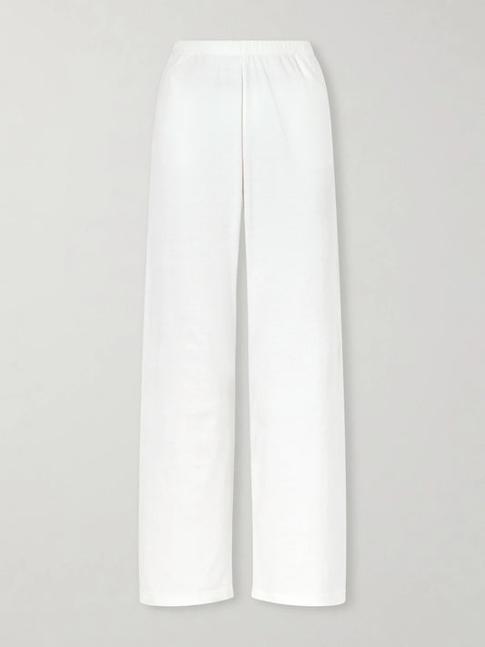 Image of a model wearing Pants. Product name - Kohana Cotton-jersey Wide-leg Pants in White colour by brand - The Row