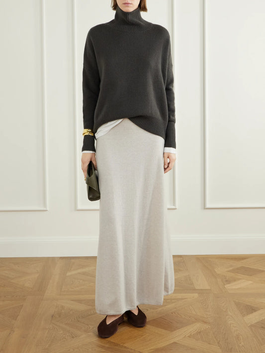 Image of a model wearing Outerwear. Product name - Heidi Cashmere Sweater in Brown colour by brand - LISA YANG