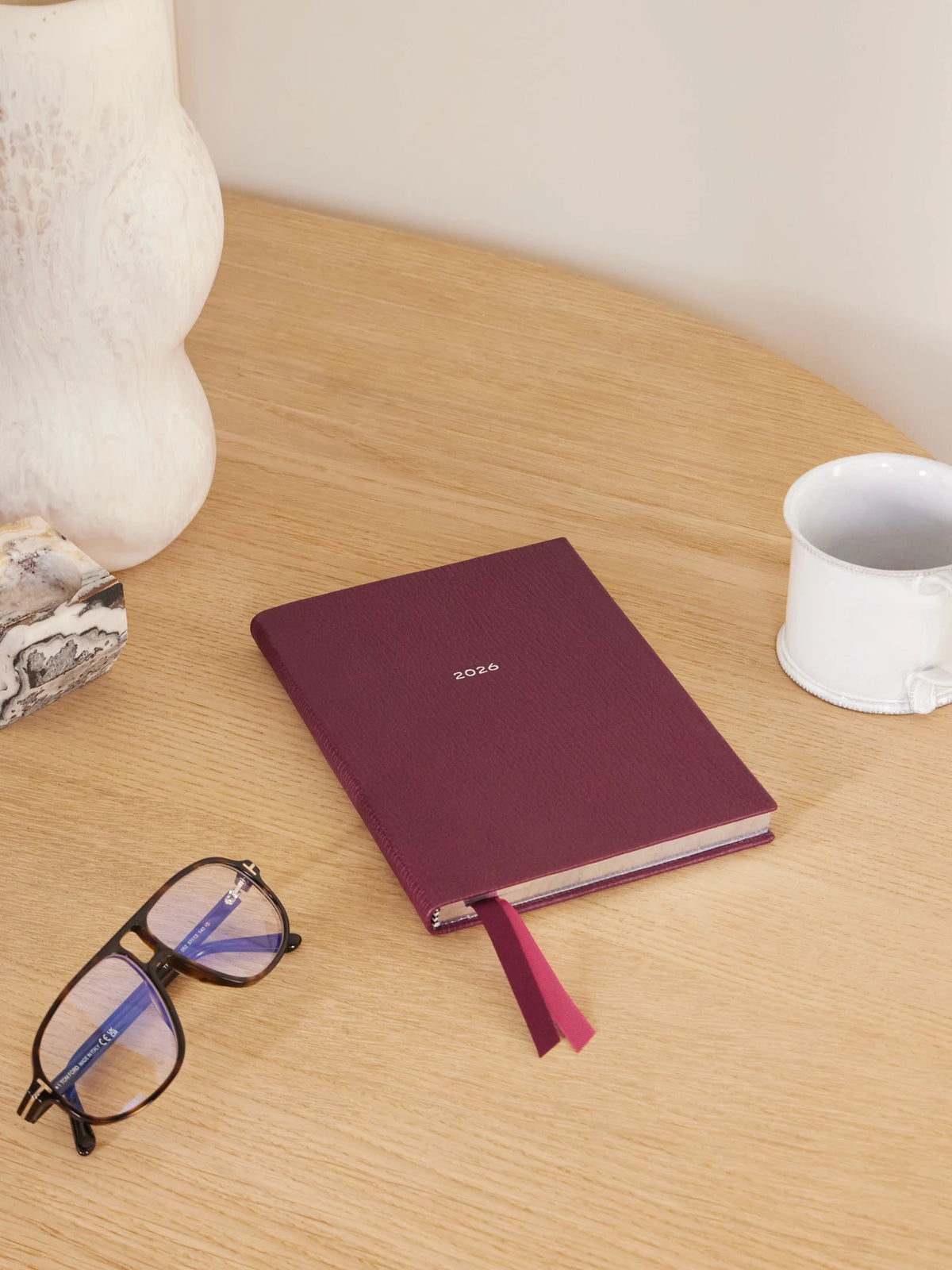 Image of Decor. Product name - Soho Ludlow 2026 Textured-leather Weekly Diary in Burgundy colour by brand - Smythson