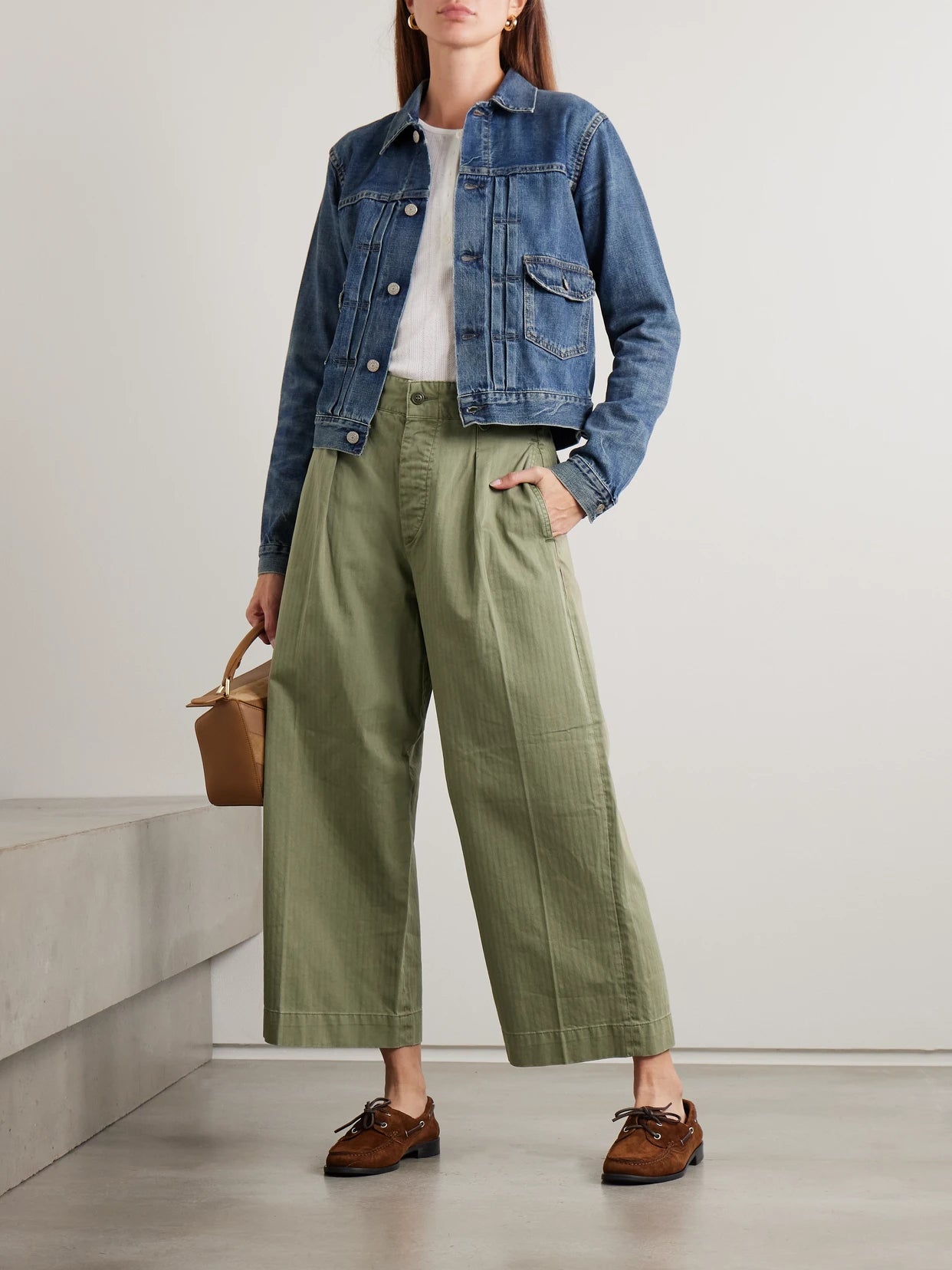 Image of a model wearing Pants. Product name - Kyle Pleated Herringone Cotton Wide-leg Pants in Army green colour by brand - RRL
