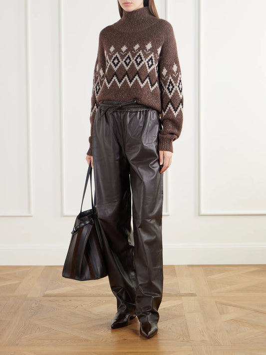 Image of a model wearing Pants. Product name - Nat Paneled Leather Straight-leg Pants in Brown colour by brand - Joseph