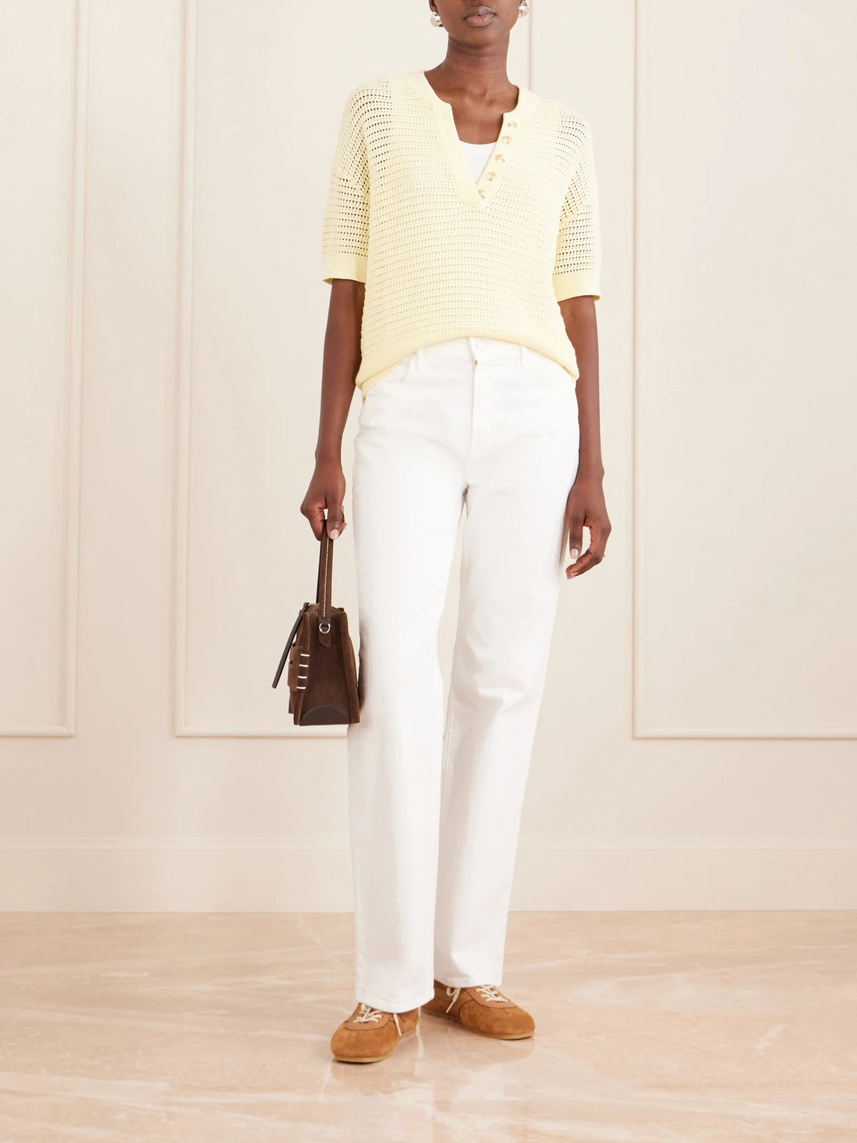 Image of a model wearing Tops. Product name - Callie Open-knit Cotton Top in Yellow colour by brand - Varley
