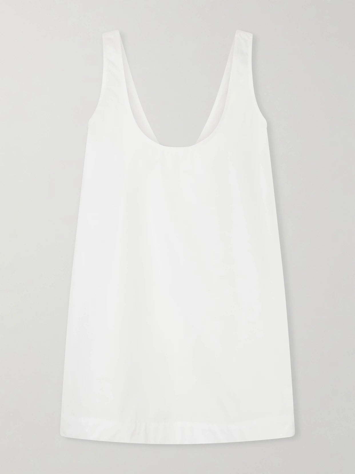 Image of a model wearing Tops. Product name - Cotton-poplin Tank in White colour by brand - TOTEME