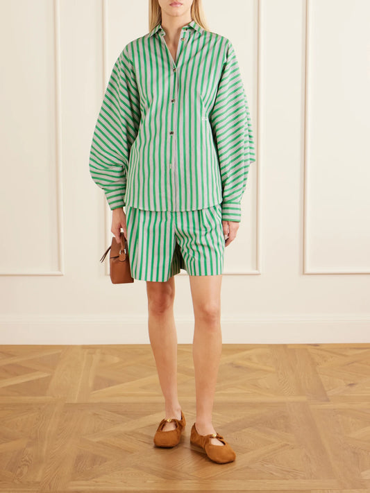 Image of a model wearing Shorts. Product name - Striped Pleated Cotton-poplin Shorts in Green colour by brand - LOEWE