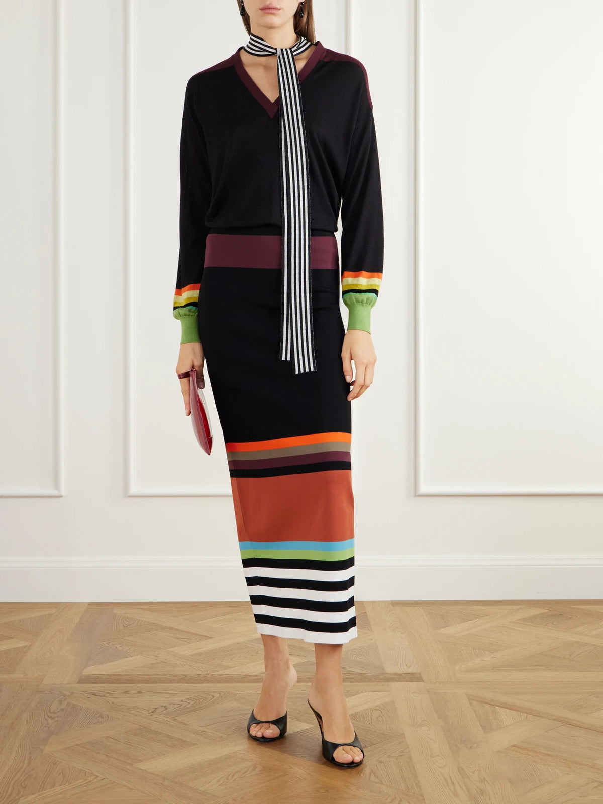 Image of a model wearing Skirts. Product name - Striped Stretch-jersey Midi Skirt in Multi colour by brand - Christopher John Rogers