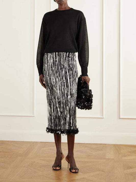 Image of a model wearing Skirts. Product name - The Sinclair Sequin-embellished Printed Pleated Satin Midi Skirt in Black colour by brand - Brandon Maxwell