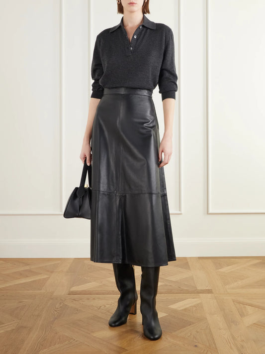 Image of a model wearing Skirts. Product name - The Ada Paneled Leather Midi Skirt in Black colour by brand - Giuliva Heritage