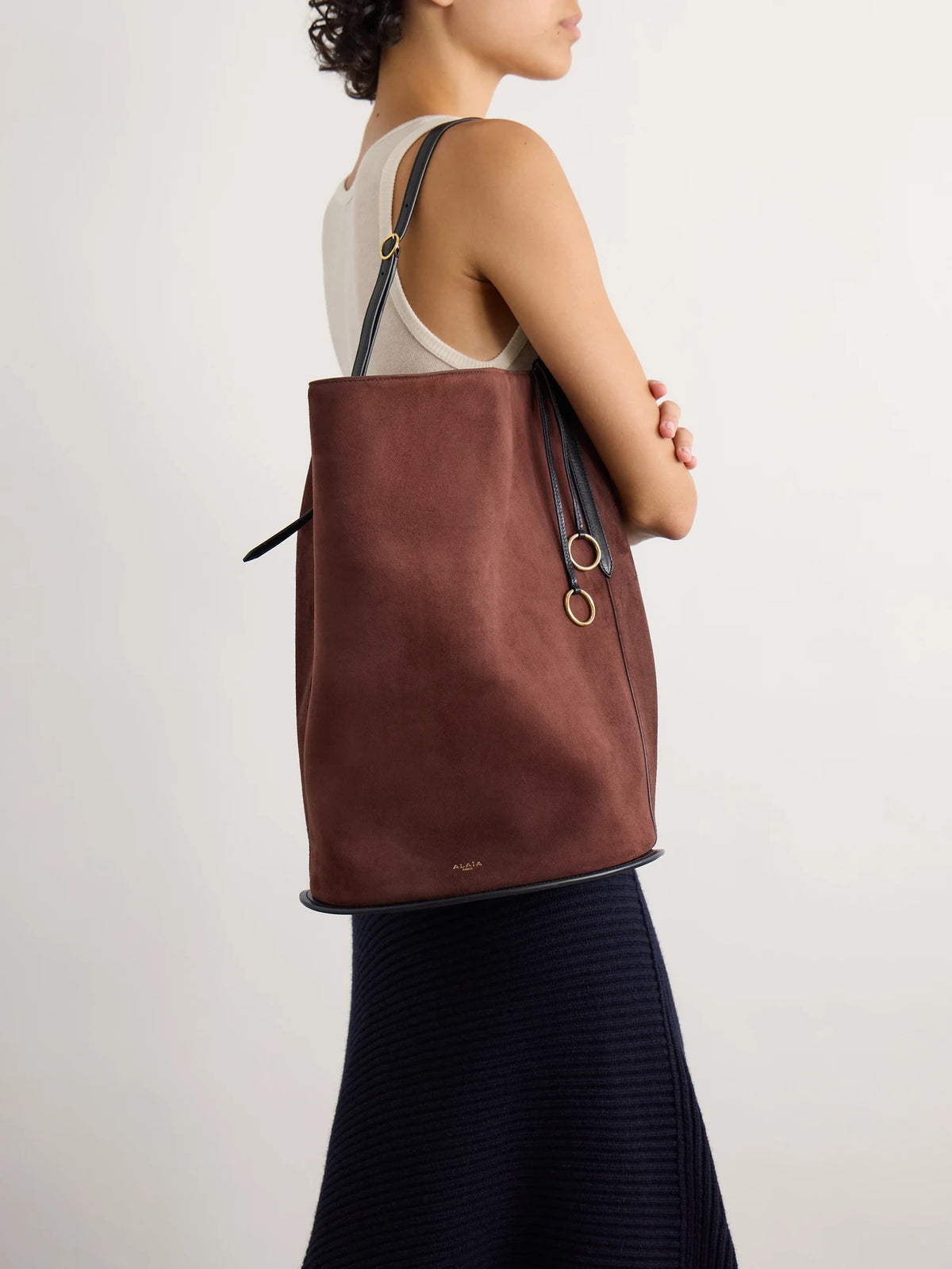 Image of Bags. Product name - Hip Large Logo-detailed Leather-trimmed Suede Bucket Bag in Brown colour by brand - Alaïa