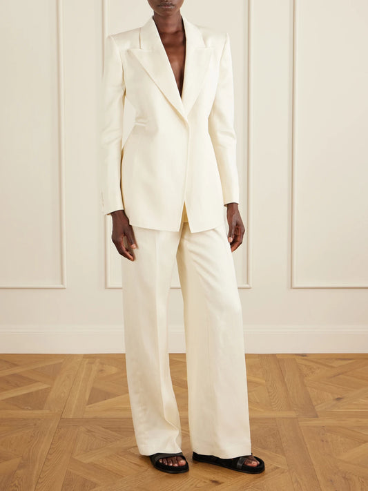 Image of a model wearing Outerwear. Product name - Epona Belted Linen Blazer in Ivory colour by brand - Gabriela Hearst