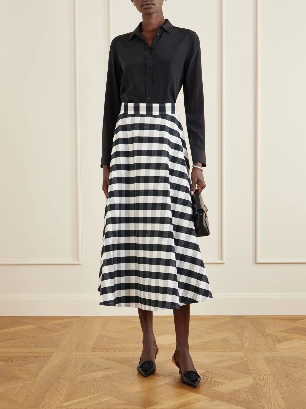 Image of a model wearing Skirts. Product name - Vichy Cotton-blend Maxi Skirt in Black colour by brand - Marta Ferri