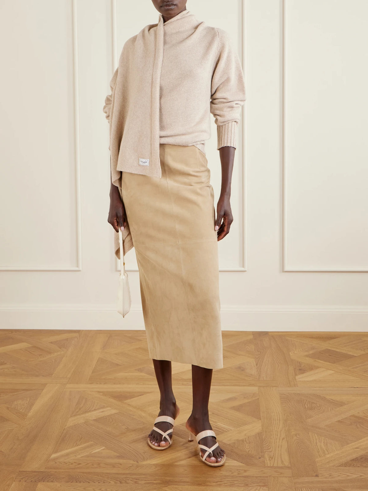 Image of a model wearing Outerwear. Product name - Draped Wool Sweater in Beige colour by brand - The Attico