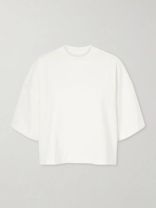 Image of a model wearing Tops. Product name - Box Cotton-jersey T-shirt in White colour by brand - SLVRLAKE